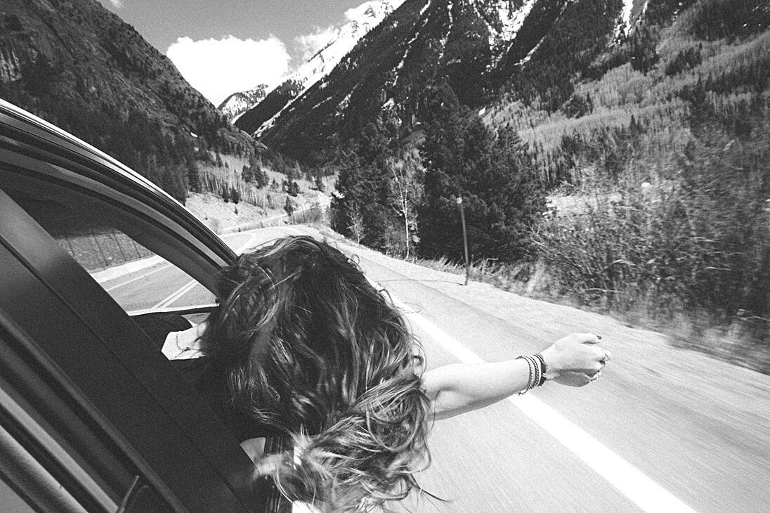Woman Enjoying Road Travel